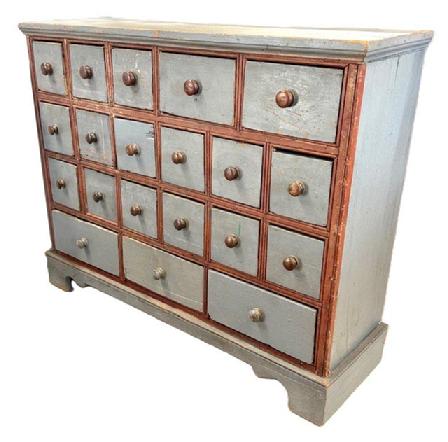 **SOLD** M88 Late 19th century Western Maryland 20 drawer Apothecary retaining original pewter gray paint with original red painted double beaded edge molding surrounding the drawers. Unusual drawer configuration with an applied bracket base and applied molding along the top. Square head nail and small wire nail construction. The wood is pine. Measurements: 44 &frac34;� wide x 13 &frac34;� deep x 35 &frac34;� tall.  