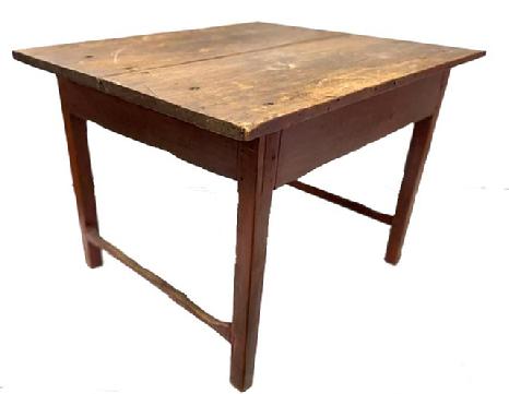 M247 Fantastic 18th century New England stretcher base tavern table in original old red painted surface with scrubbed top. The boards on the two-board top are a full 1� thick and are secured to the base with large rosehead nails. The apron, legs and stretchers are fully mortised and pegged. Stretchers are original and show great wear. Circa 1770. Measurementsn to floor). 