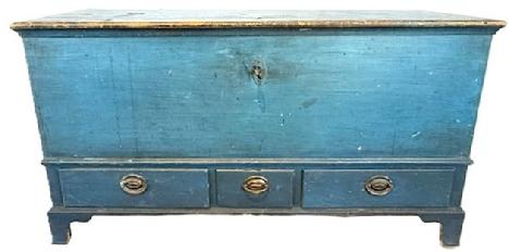 **SOLD** L532 Stunning 18th century Pennsylvania Blanket Chest with three dovetailed drawers bearing old blue (19th century) paint over original pumpkin painted surface. Chest retains its original strap hinges and working crab lock with key. Dovetailed case with applied molding surrounding the lid, resting on an applied bracket base with tall cut out feet. Clean, natural patina interior boasts a lidded til with molded edge and a very unique �locking system� for the drawers below. Rosehead nail and wooden pegged construction. Circa 1750s. Measurements: 50� wide x 22� deep x 26 &frac12;� tall. 