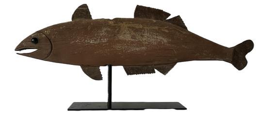 L37 Large Midwestern wooden Fish weathervane in original paint with shaped cut tin fins and tail and carved mouth and gills. The eyes are constructed of two green glass marbles. Mounted on a removable metal stand for display purposes. Found in Indiana. Measurements: 35" long x ~10 &frac12;� tall x 1" thick. Overall height on stand is 15� tall. 
