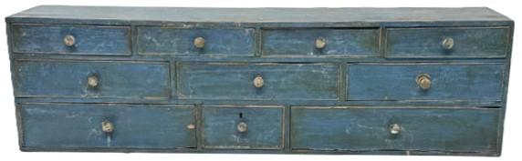 **SOLD** M171 Early 19th century Pennsylvania blue painted Apothecary with an unusual layout of ten drawers with cock beaded fronts and brass knobs. One drawer has a divided interior. Dovetailed case and drawers with a combination of �T� nail and square head nail construction throughout. The woods are walnut and white pine. Circa 1800-1810. Faint, illegible names / writing on bottom of one of the drawers appears to show a succession of how this chest was passed through a family and indicates various dates including 1813, 1862 and 1900.  Measurements: 36� wide x 8� deep x 10� tall. 