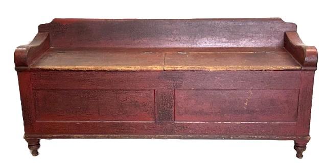 **SOLD** M126 18th century Lancaster County, Pennsylvania Wood box / Settee with divided lift top in original red painted surface. Post and Paneled construction with a dovetailed divided interior. Posts end in round turnings creating the feet. �T� and square head nail construction. The numbers �54-34-55� and �531� are painted in white on one arm / top of back. We are unsure if these were Museum numbers or for insurance purposes at some point in time. Measurements: 63 3/8� wide x 19� deep x 28 &frac34;� tall (back) x 21 &frac12;� tall (front). The arms are 2 &frac34;� wide.  