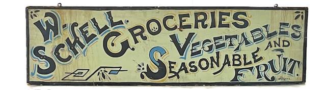 **SOLD** M33 Exceptional late 19th century single sided wood Advertising Sign for: �W. Schell Groceries� �Seasonable Vegetables And Fruit�. Single sided with the lettering being hand painted in black with light blue, red, and mustard yellow shadowing on a white background. A black painted border surrounds the edges and it is signed by artist - �Weiser� - in the lower right corner. One board construction with early iron eye hooks in top for hanging.Circa 1890s-1900. Measurements: 47 &frac14;� wide x 1� thick x 13 &frac14;� tall.  