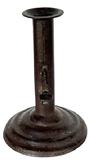 M116F Rare, tapered / stacked base Hog Scraper candlestick with illegible maker�s stamp on the push-up tab. Sheet iron construction with nice weight and unusual base, with no evidence of ever having a finger curl. Wonderful original surface. Measurements: 4 1/8� bottom diameter x 6� tall.   